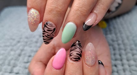 Colorful nail art design at Urban Nails At Jocelynn in Pretoria, Gauteng, ZA showcasing glitter and patterns.