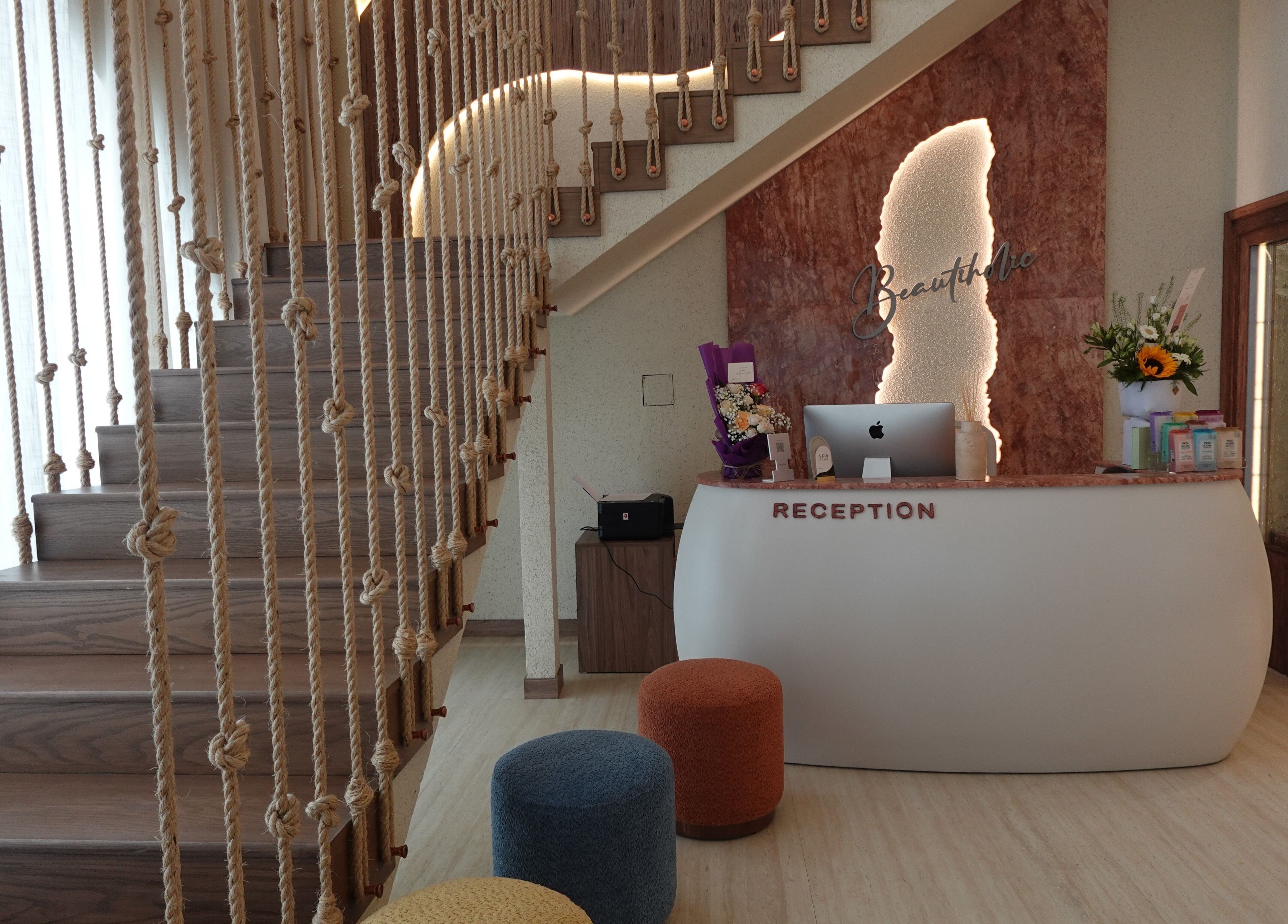 Modern reception area at Beautiholic salon, Al Khobar, Eastern Province, SA with chic decor and ambient lighting.