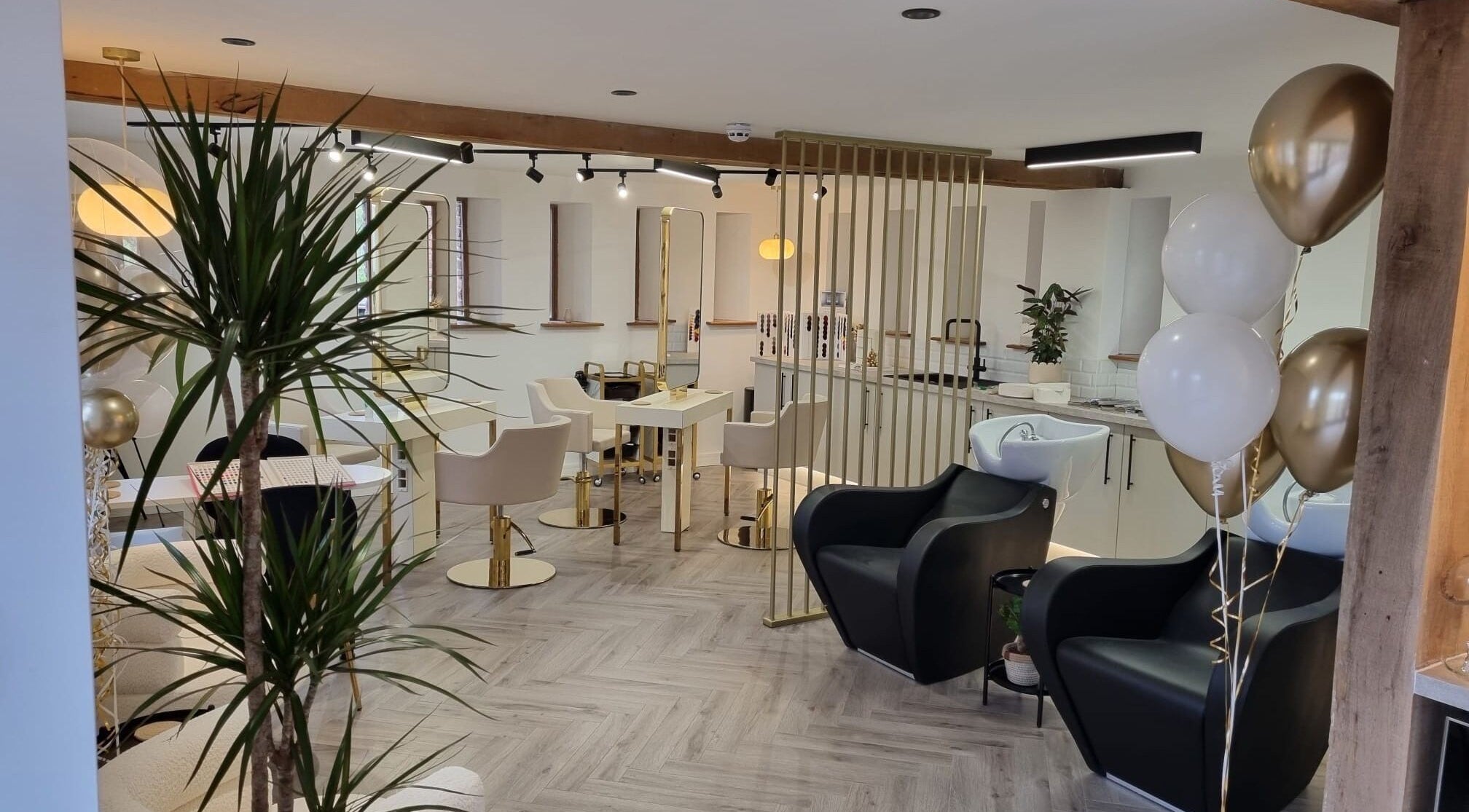 Chic interior of GOLDSOUL Hair & Beauty at Homme Castle Barns, Shelsley Walsh with stylish decor and modern amenities.