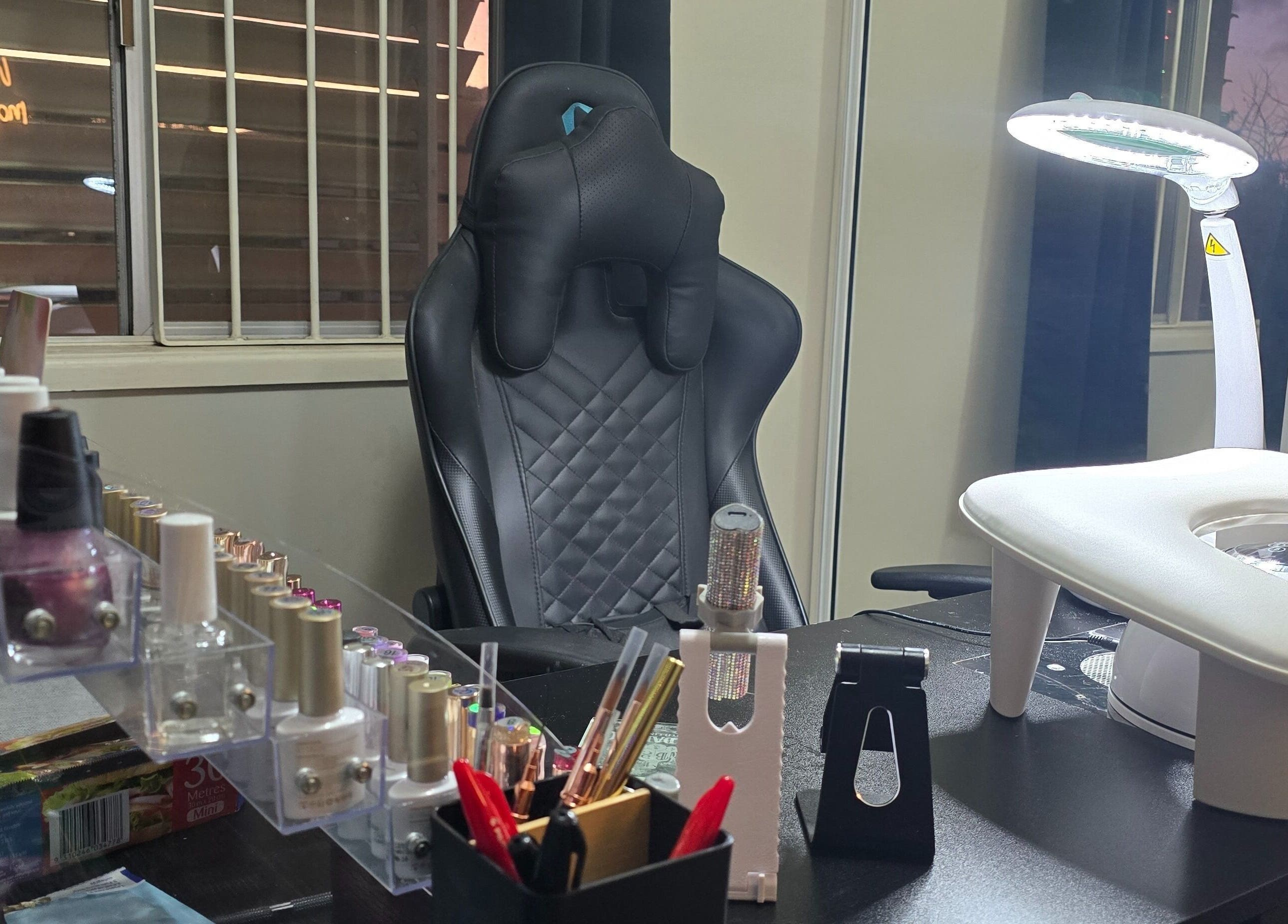 Modern nail service setup at Kassia Nails in Raceview, Queensland, AU, featuring tools and a comfortable chair.