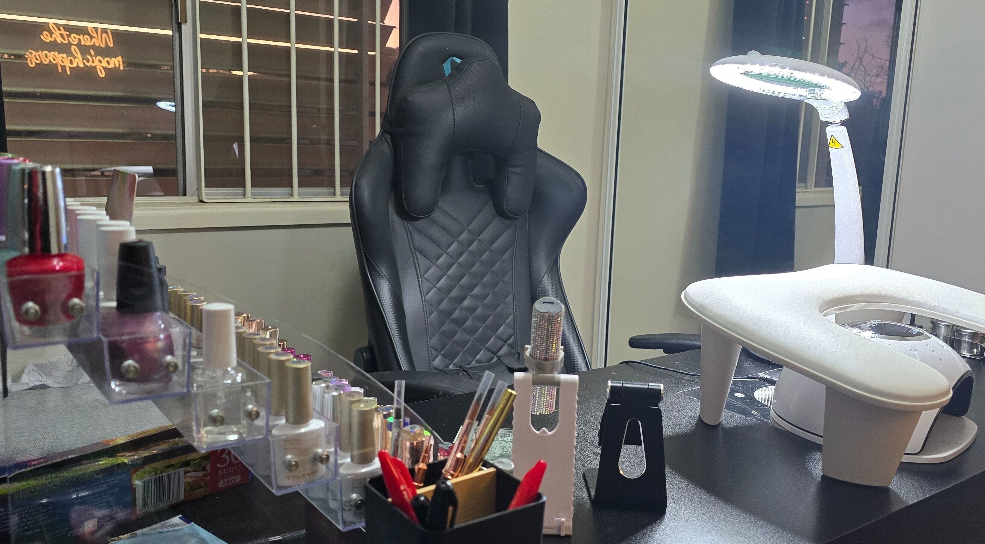 Modern nail service setup at Kassia Nails in Raceview, Queensland, AU, featuring tools and a comfortable chair.