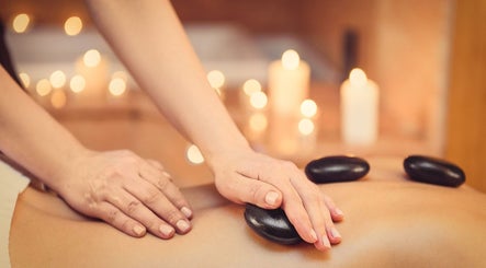 Hot stone massage at Therapy Lodge, Battle, England, GB, enhancing relaxation and wellness.