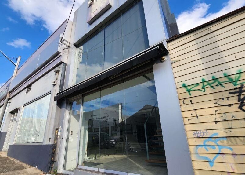 Entrance of TOKYO LASH (ex E's lashes by Eri) in Petersham, New South Wales, AU with a sleek glass facade.