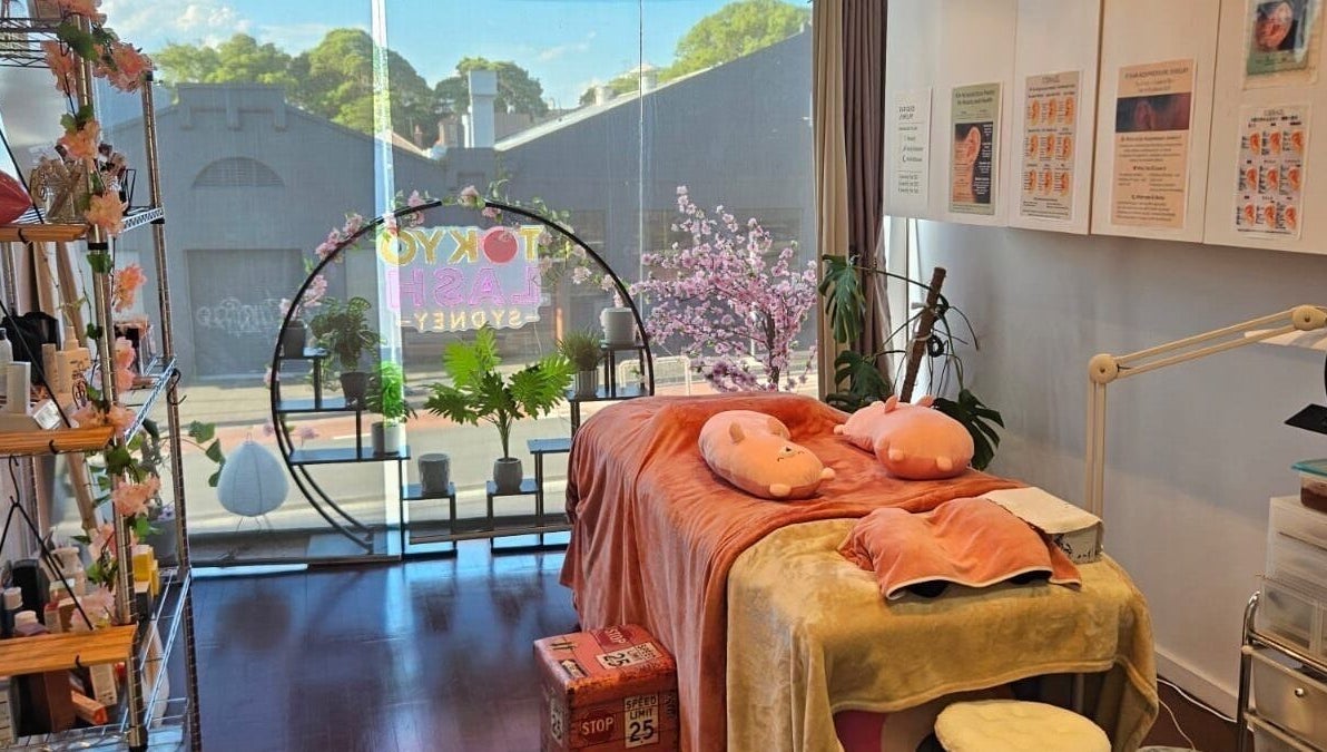 Cozy treatment room at TOKYO LASH, Petersham, New South Wales, AU with pink decor and large window view.