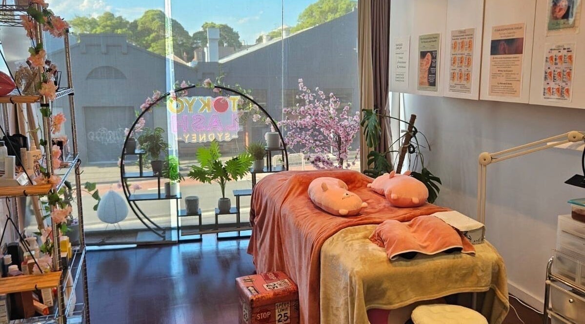Cozy treatment room at TOKYO LASH, Petersham, New South Wales, AU with pink decor and large window view.