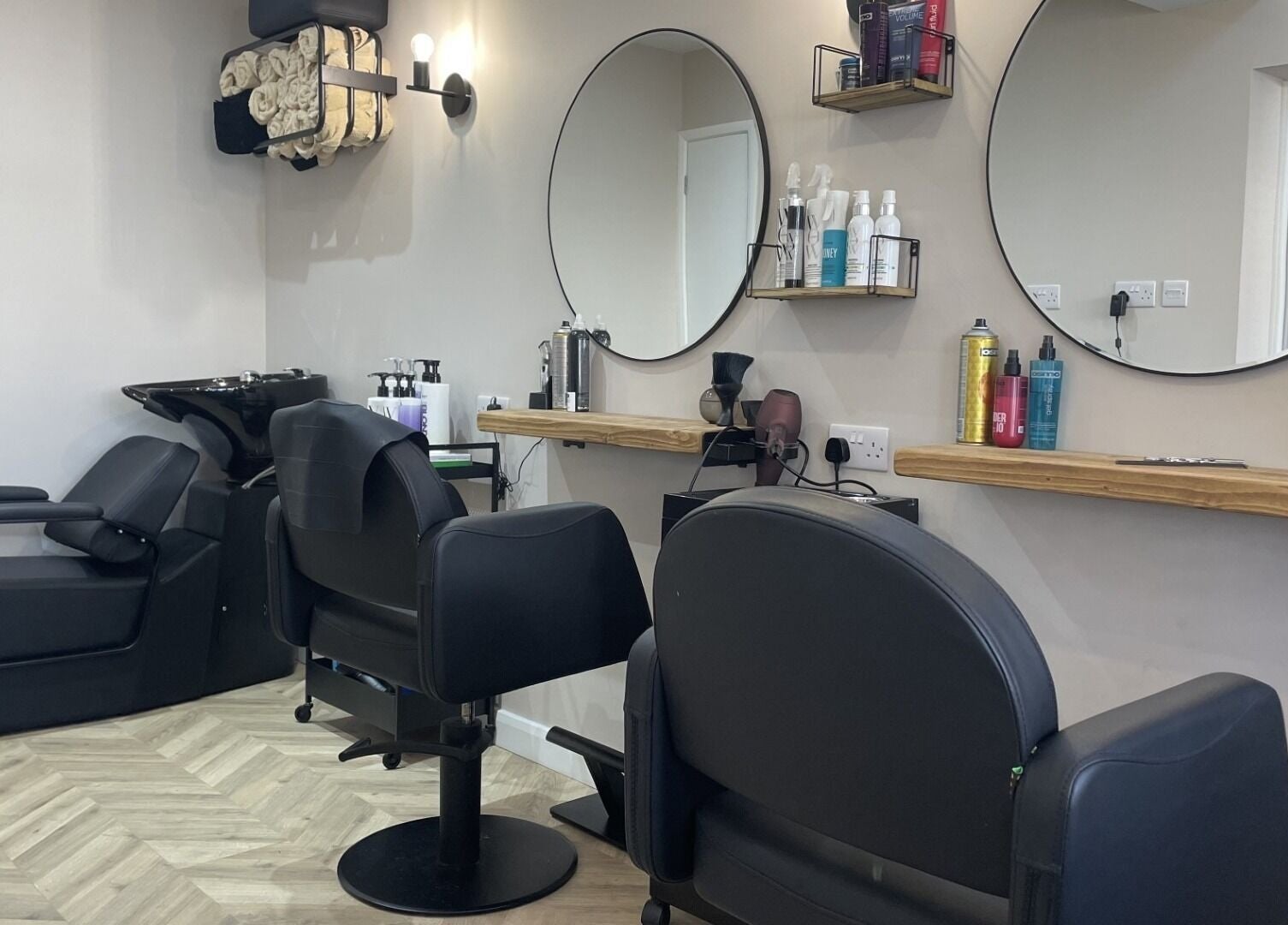 Chic salon interior with styling stations at Elle @ Studio Twenty One, Rugby, England, GB.