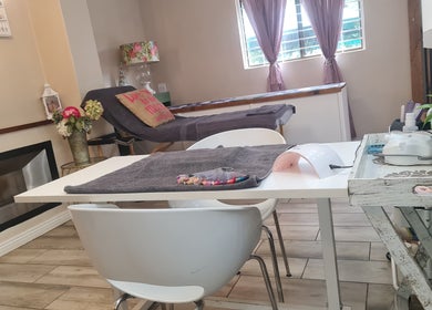 Inviting interior of Nails By Riska ° Hair by Megs in Potchefstroom, North West, ZA with a treatment table.