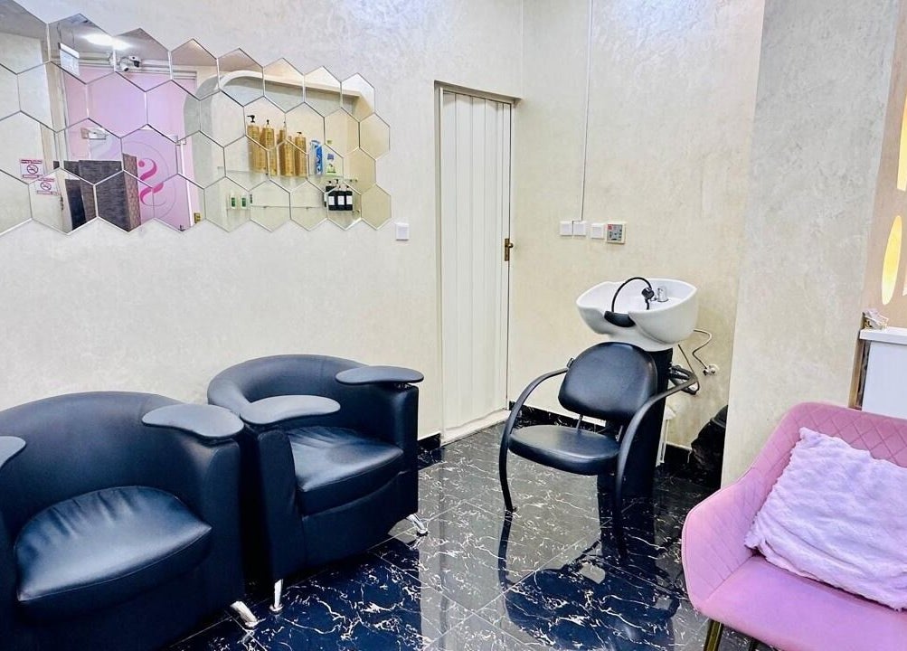 Cozy seating and wash area at Samiha Alsarraj Ladies Salon in Sharjah, Sharjah, AE, featuring stylish decor.