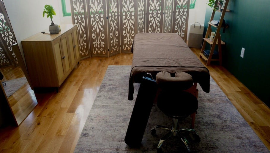 Tranquil massage room at A1A Massage in New York, New York, US, featuring a massage table and elegant decor.