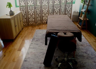 Tranquil massage room at A1A Massage in New York, New York, US, featuring a massage table and elegant decor.