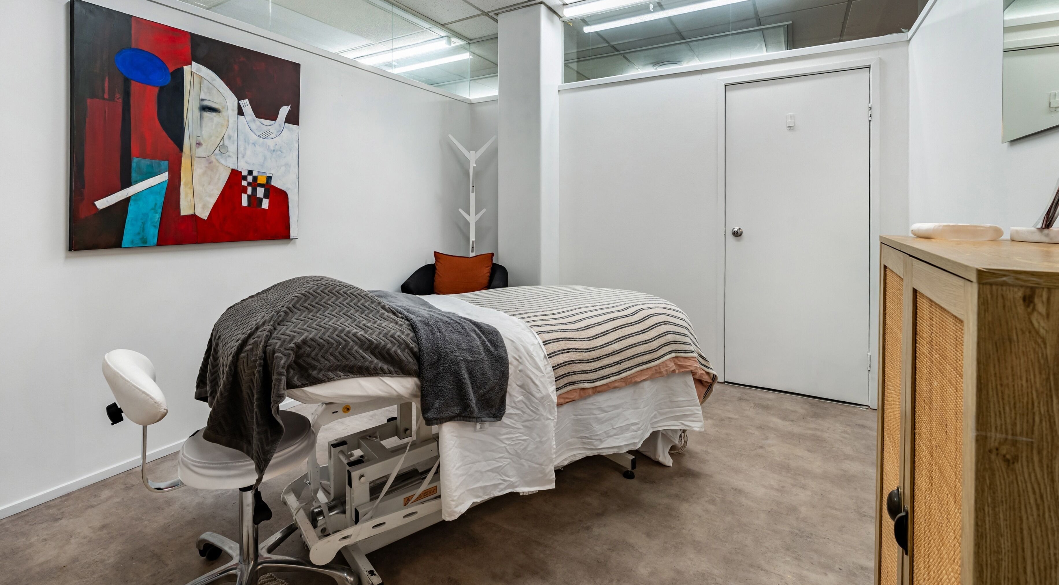 Relaxing treatment room with abstract art at Beauty Refinery, Auckland, Auckland, NZ.