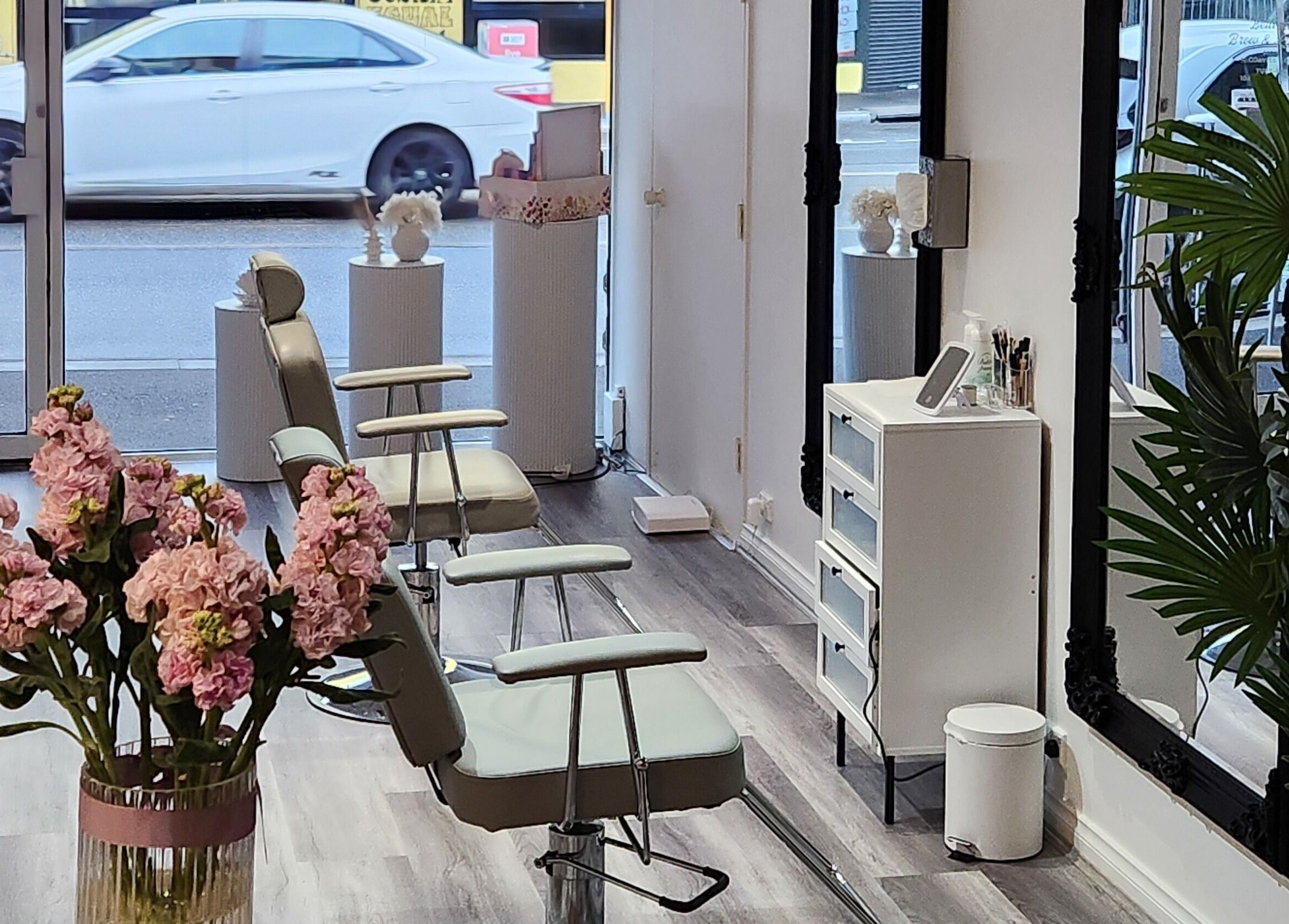 Stylish interior of Belleza Brows & Lashes in Melbourne, Victoria, AU with elegant seating and decor.