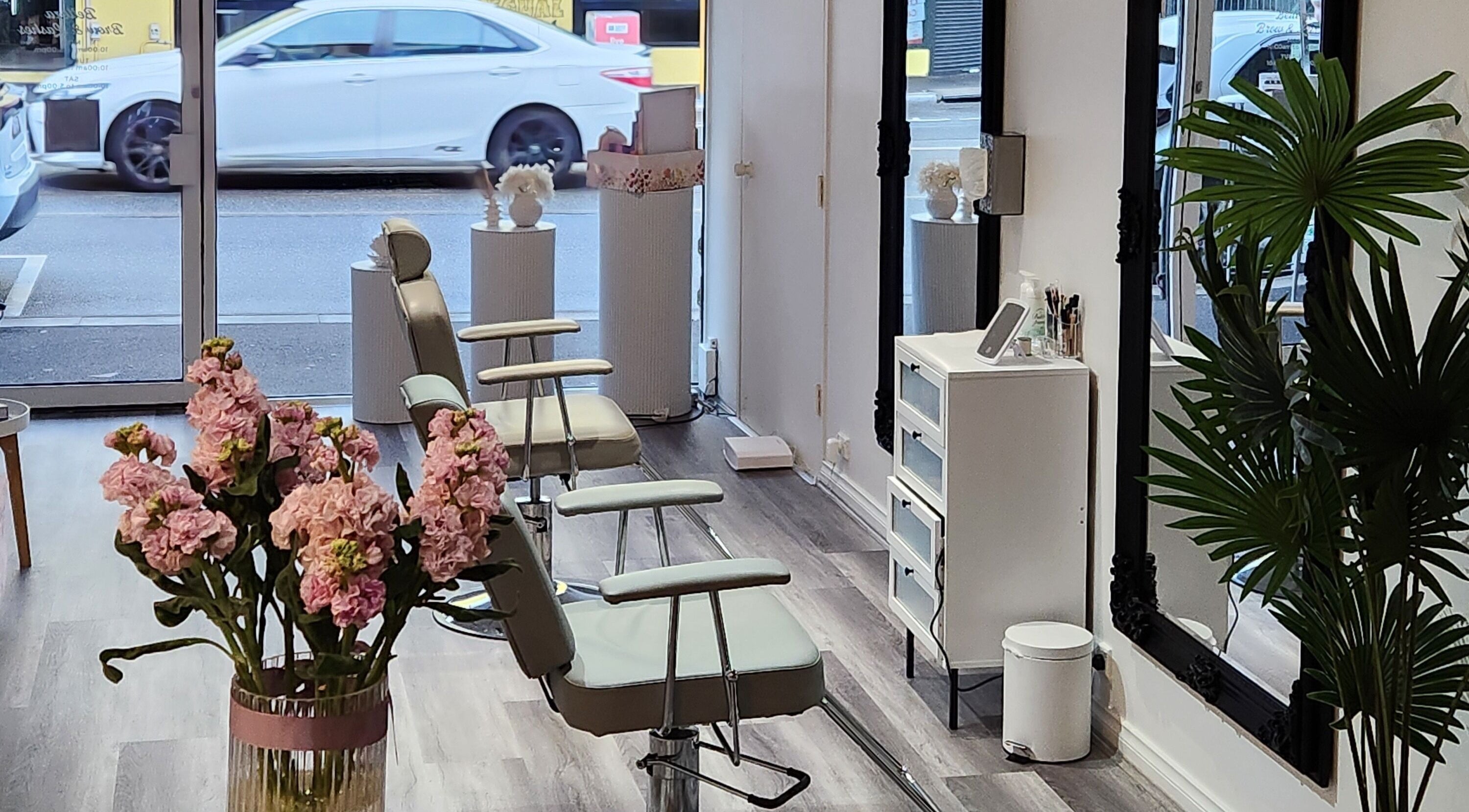 Stylish interior of Belleza Brows & Lashes in Melbourne, Victoria, AU with elegant seating and decor.