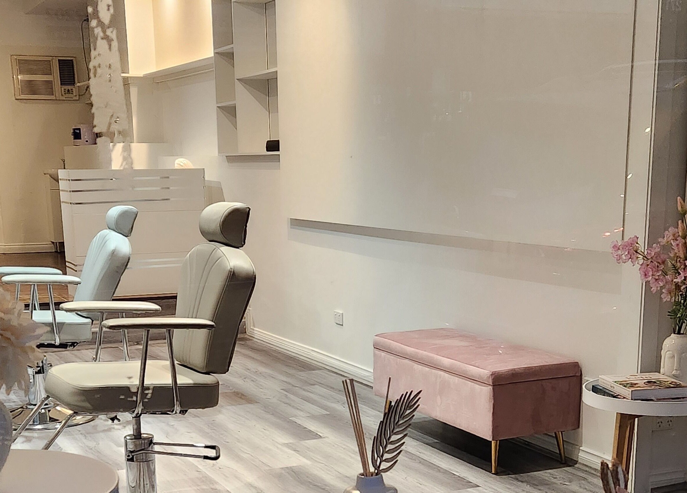 Chic interior of Belleza Brows & Lashes in Melbourne, Victoria, AU featuring plush chairs and decor.