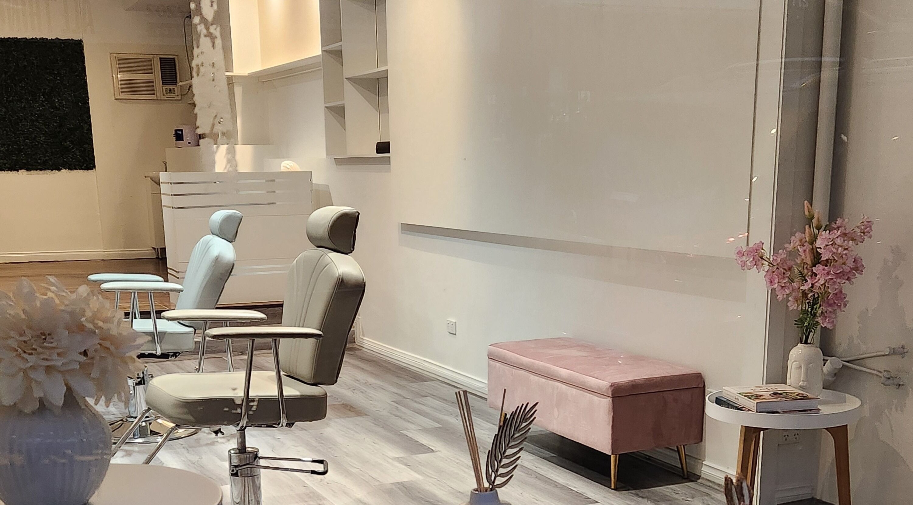 Chic interior of Belleza Brows & Lashes in Melbourne, Victoria, AU featuring plush chairs and decor.