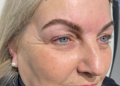 Close-up of a woman after eyebrow treatment at Lumina Beauty & Aesthetics, Whittlesey, England, GB.