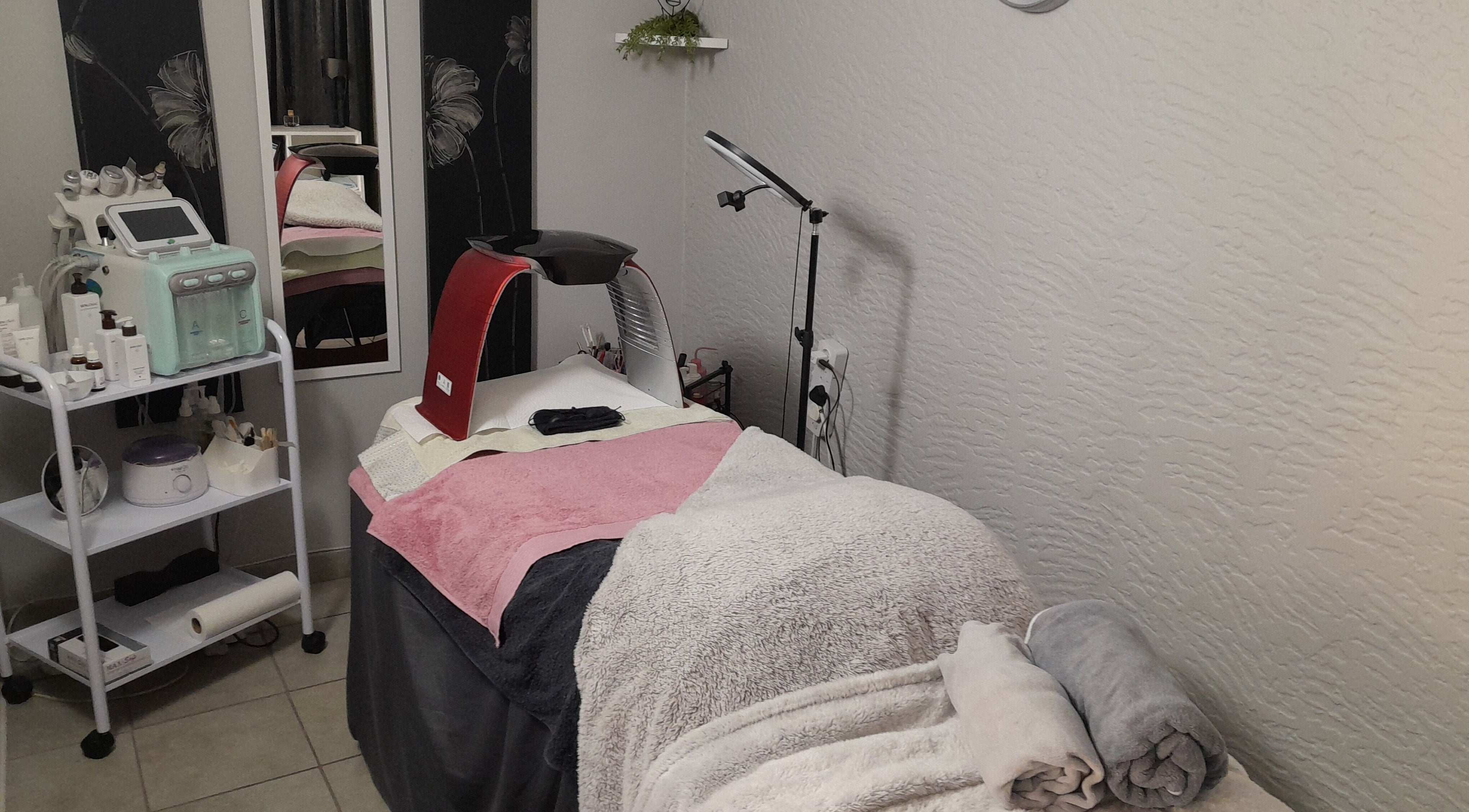 A soothing treatment room at Fantabulous Beauty and Slimming, Kempton Park, Gauteng, ZA with elegant decor.
