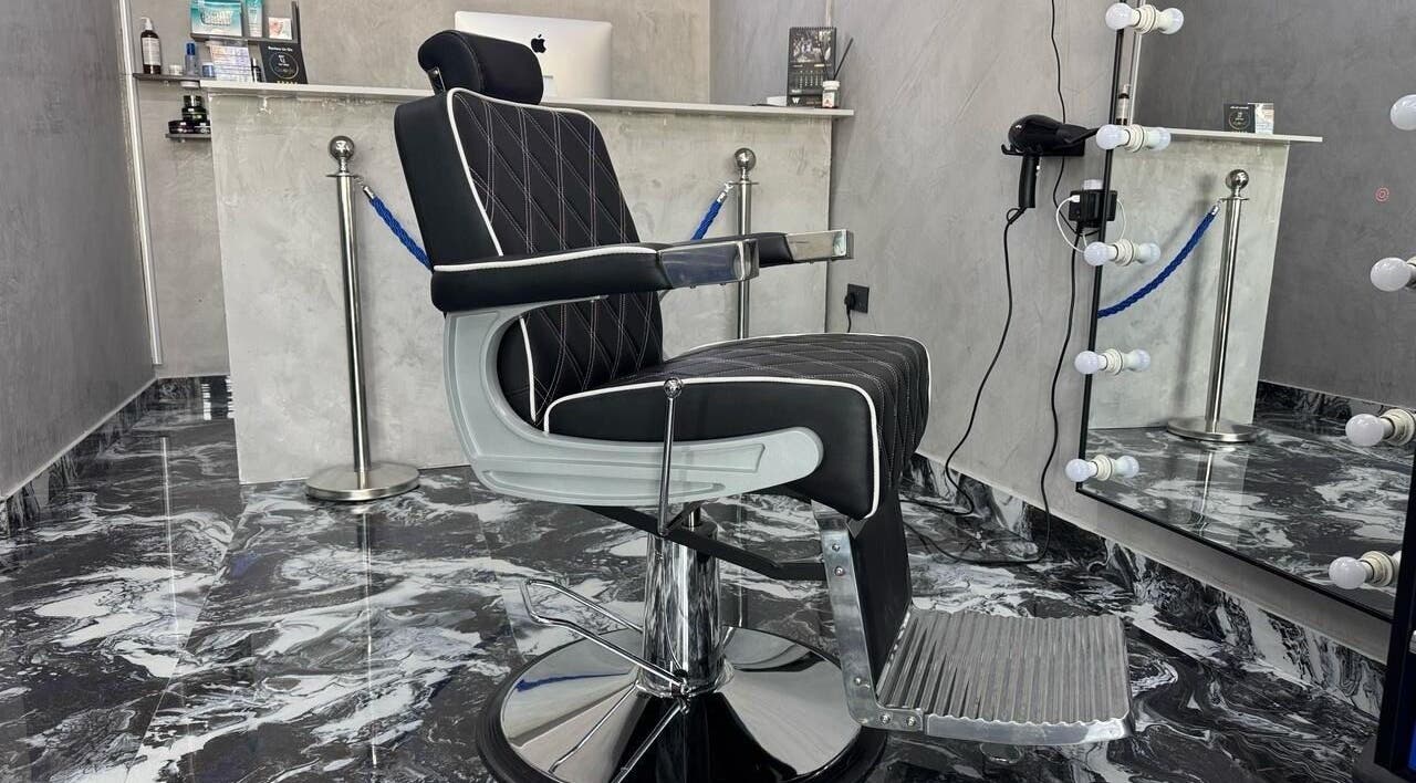 Modern barber chair at A Club Barbers, Dubai, Dubai, AE, reflecting luxury and style in a chic setting.