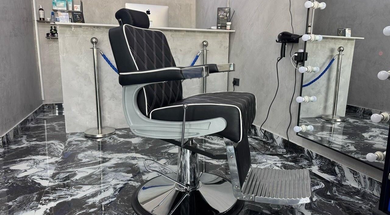 Modern barber chair at A Club Barbers, Dubai, Dubai, AE, reflecting luxury and style in a chic setting.