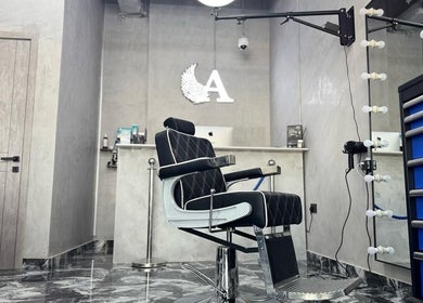 Elegant black barber chair at A Club Barbers, Dubai, Dubai, AE, showcasing sleek modern design.