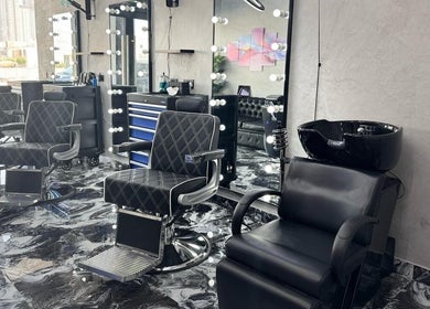 Modern barber chairs and washbasin at A Club Barbers, Dubai, Dubai, AE, offering a premium grooming experience.