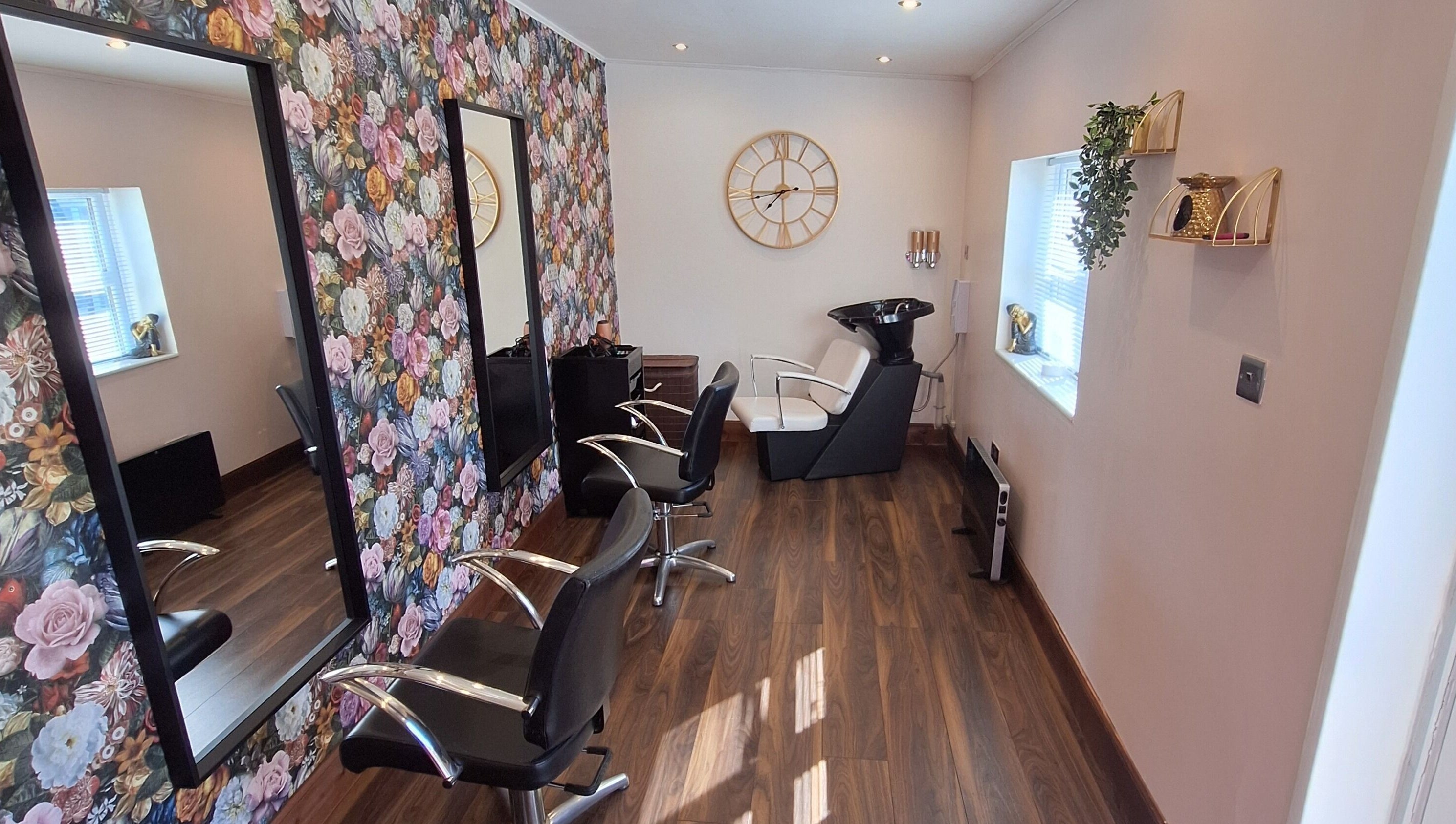 Boujee_Barnet salon in Ayr, Scotland, GB with floral wallpaper and stylish salon chairs.