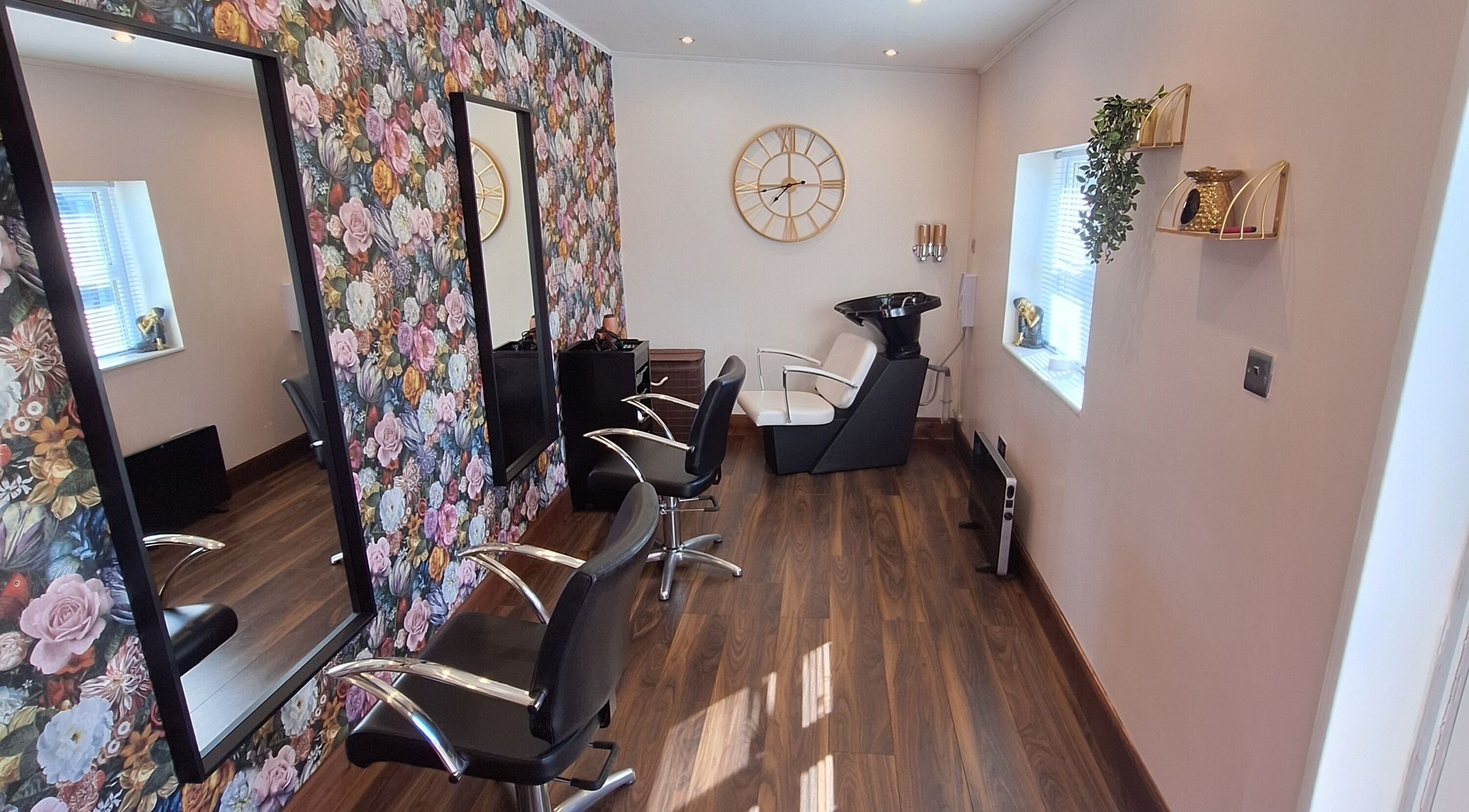 Boujee_Barnet salon in Ayr, Scotland, GB with floral wallpaper and stylish salon chairs.