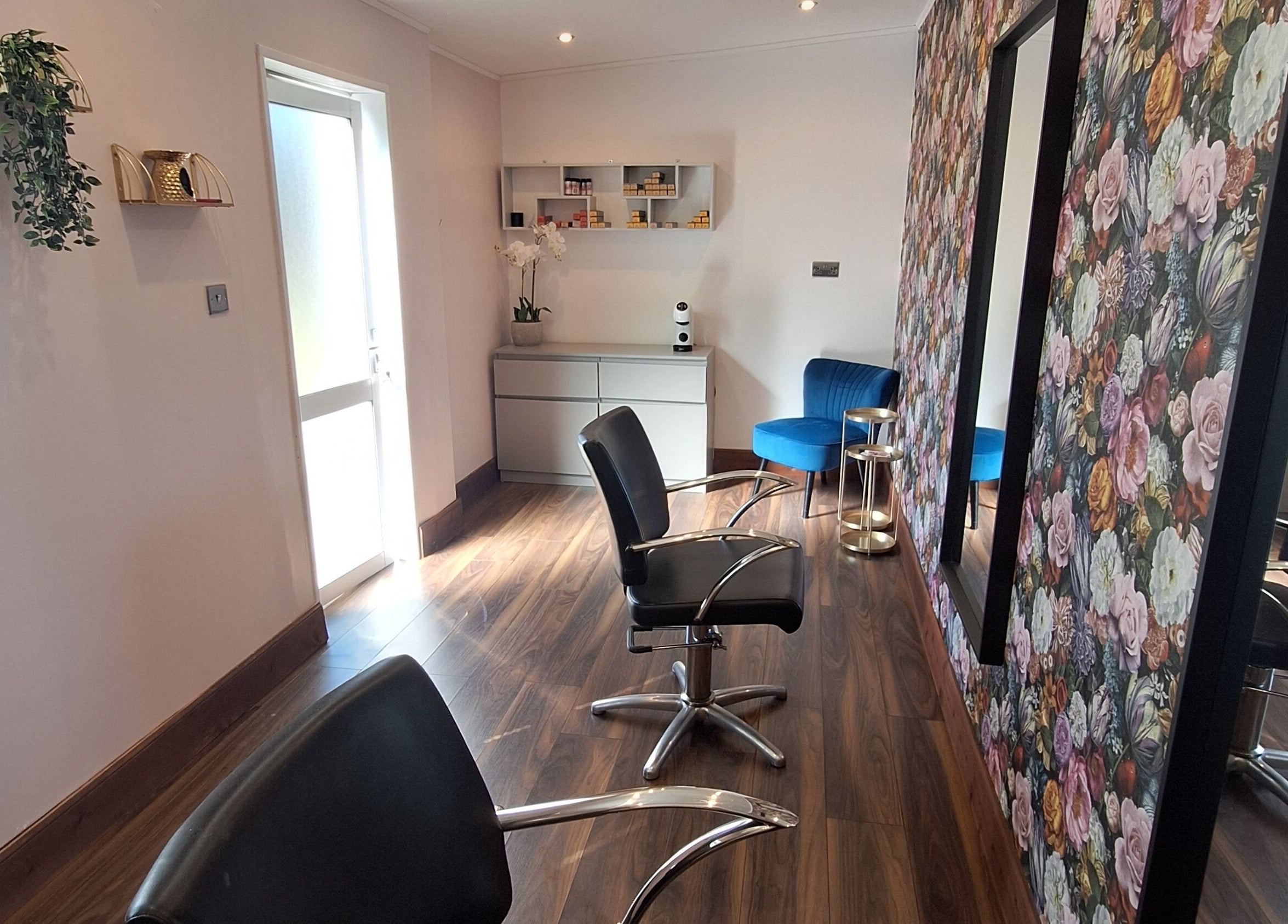 Boujee_Barnet salon interior, Ayr, Scotland, GB with stylish chairs and floral wallpaper.