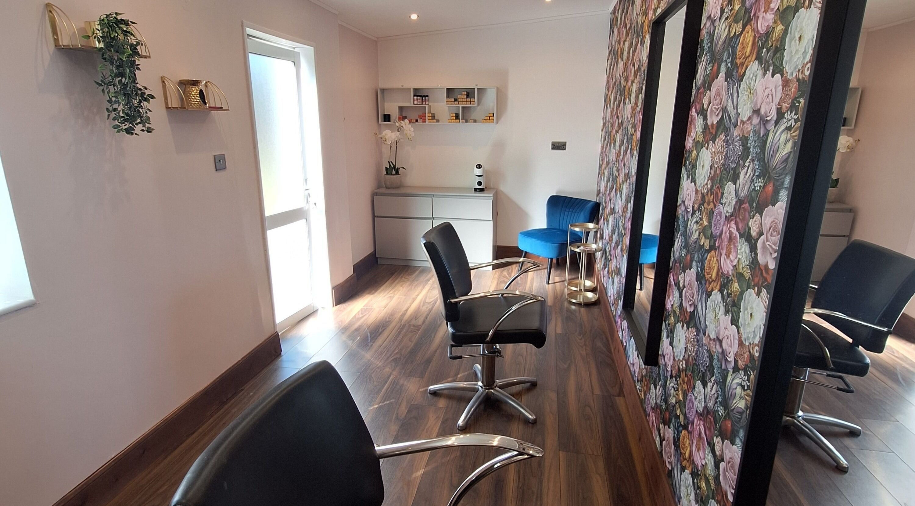 Boujee_Barnet salon interior, Ayr, Scotland, GB with stylish chairs and floral wallpaper.