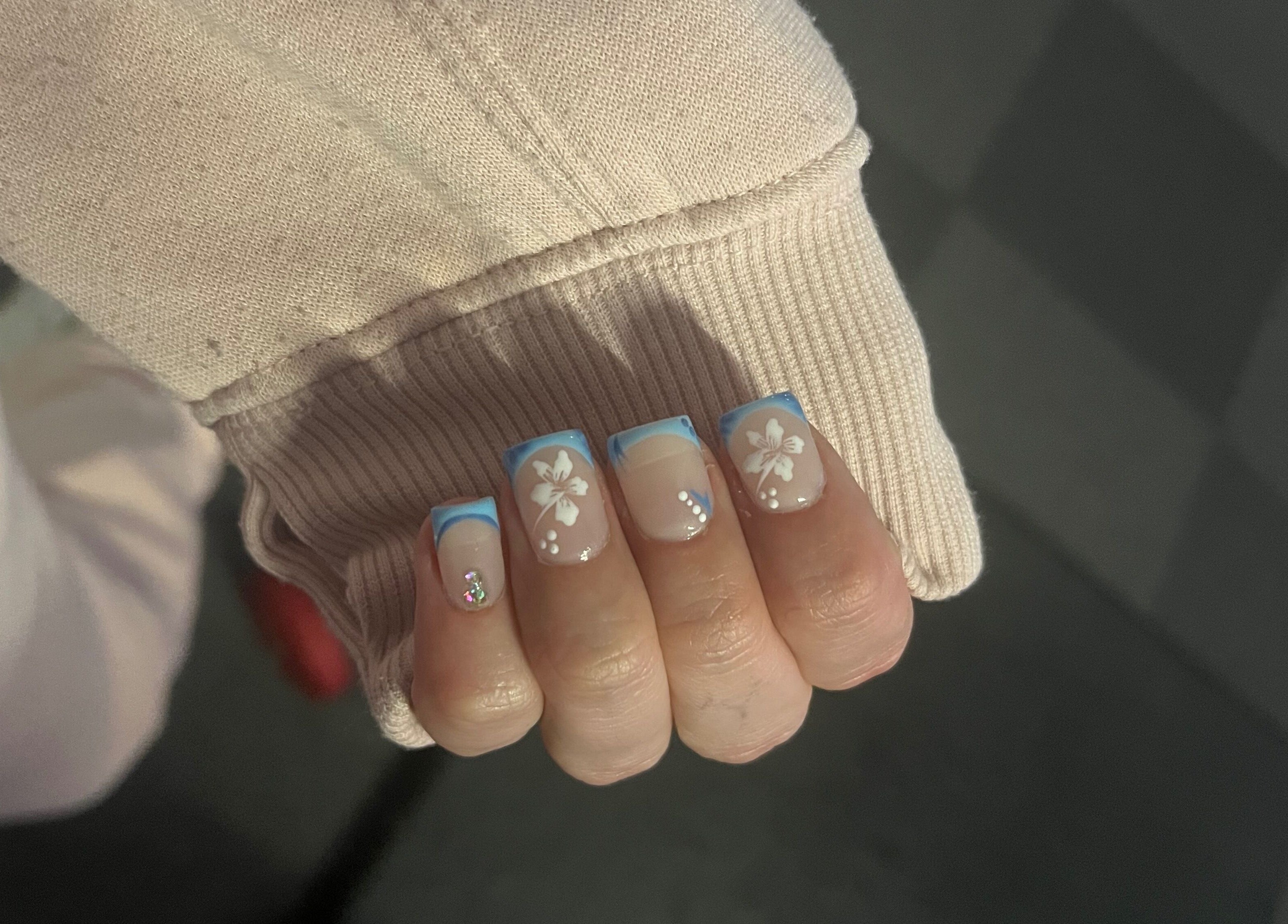 Stylish nails with blue floral design at Glam Bar Ampthill, Ampthill, England, GB. Perfect for a chic look.
