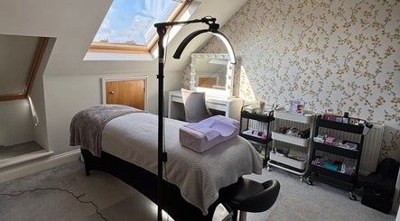 Tranquil treatment room at LA Lashes&Brows, West Wickham, England, GB, under skylight with elegant decor.