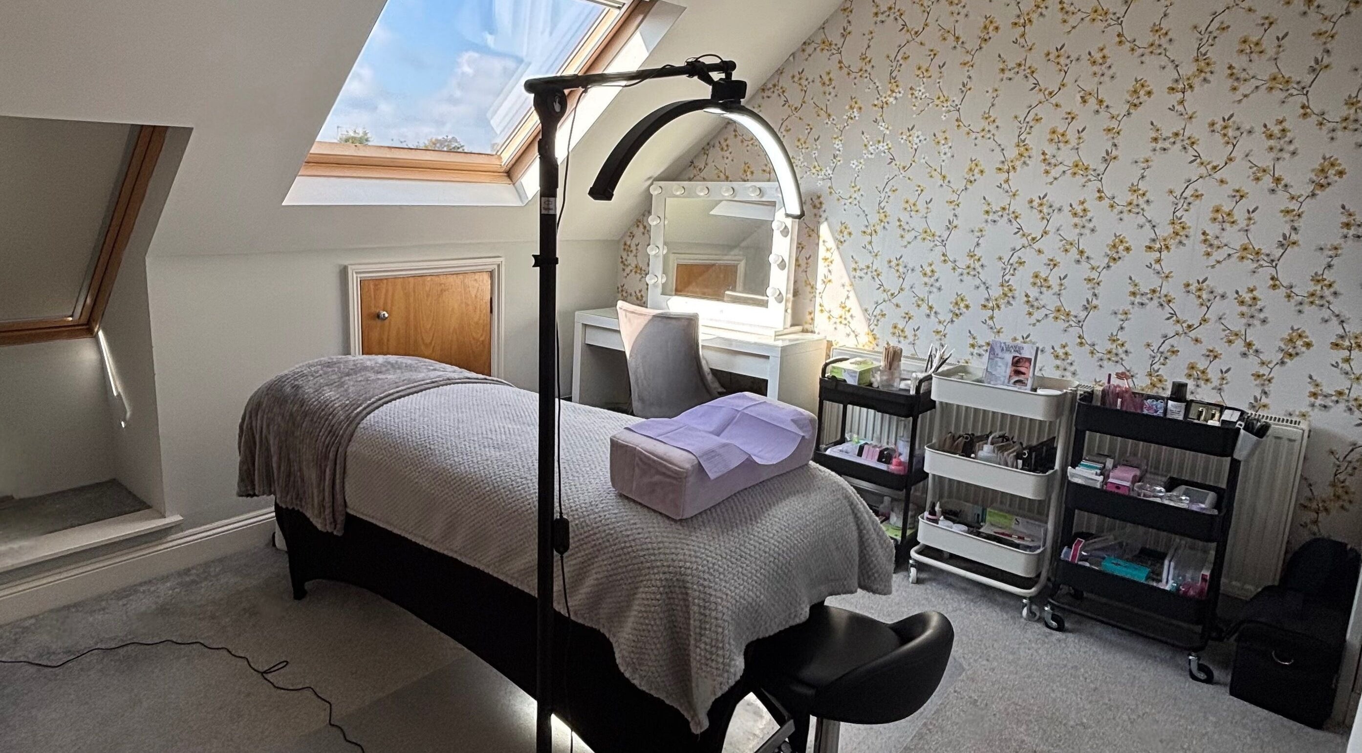 Tranquil treatment room at LA Lashes & Brows, West Wickham, England, GB, featuring modern decor and cozy bed.