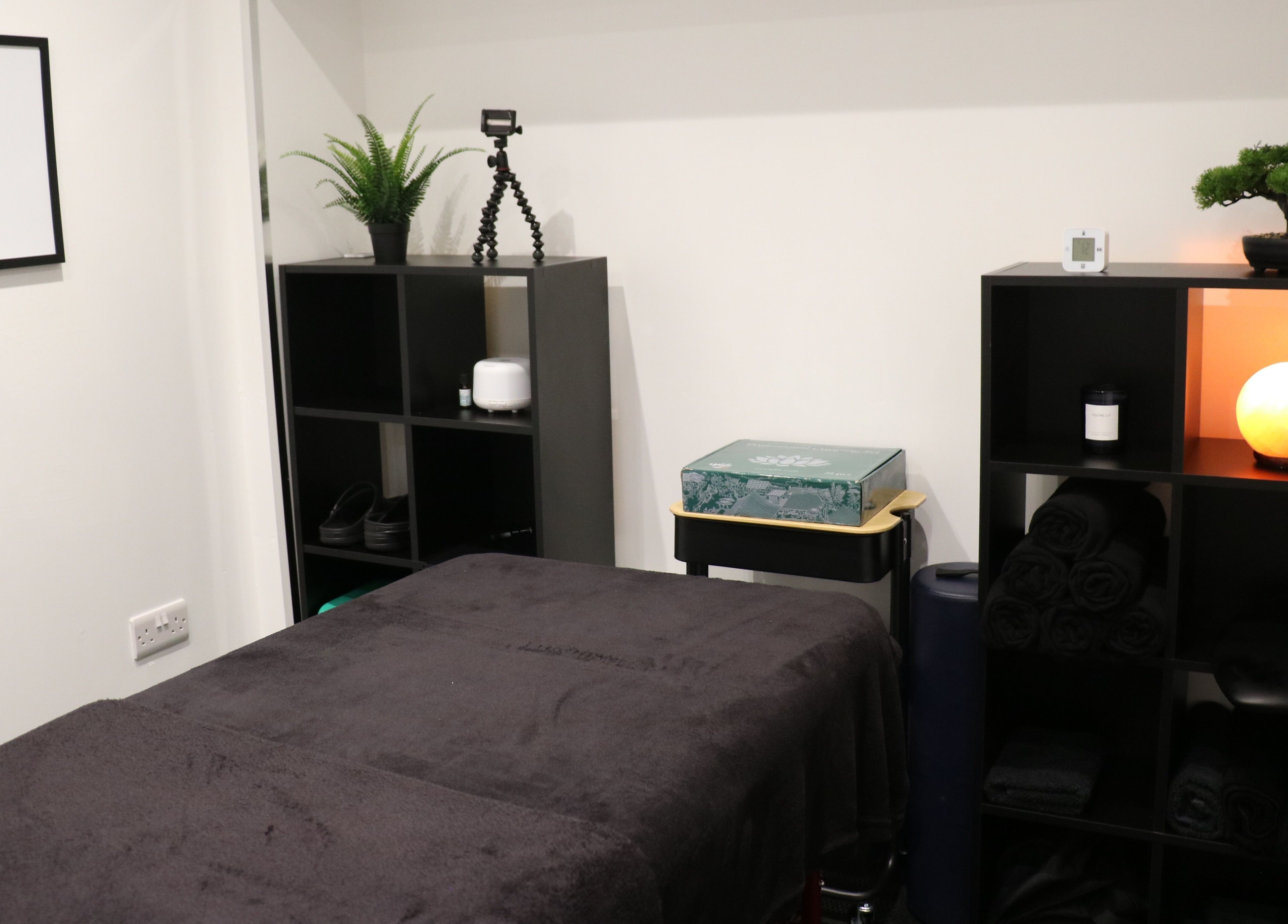 Tranquil massage room at Stealth Sports Massage in Huddersfield, England, GB with calming decor.