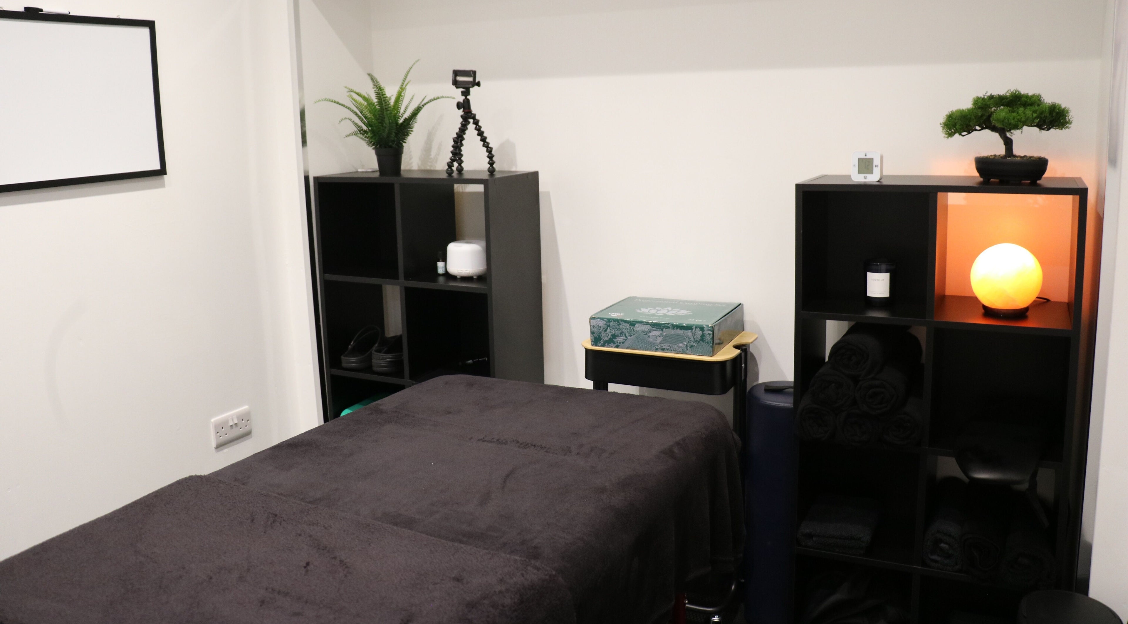 Tranquil massage room at Stealth Sports Massage in Huddersfield, England, GB with calming decor.