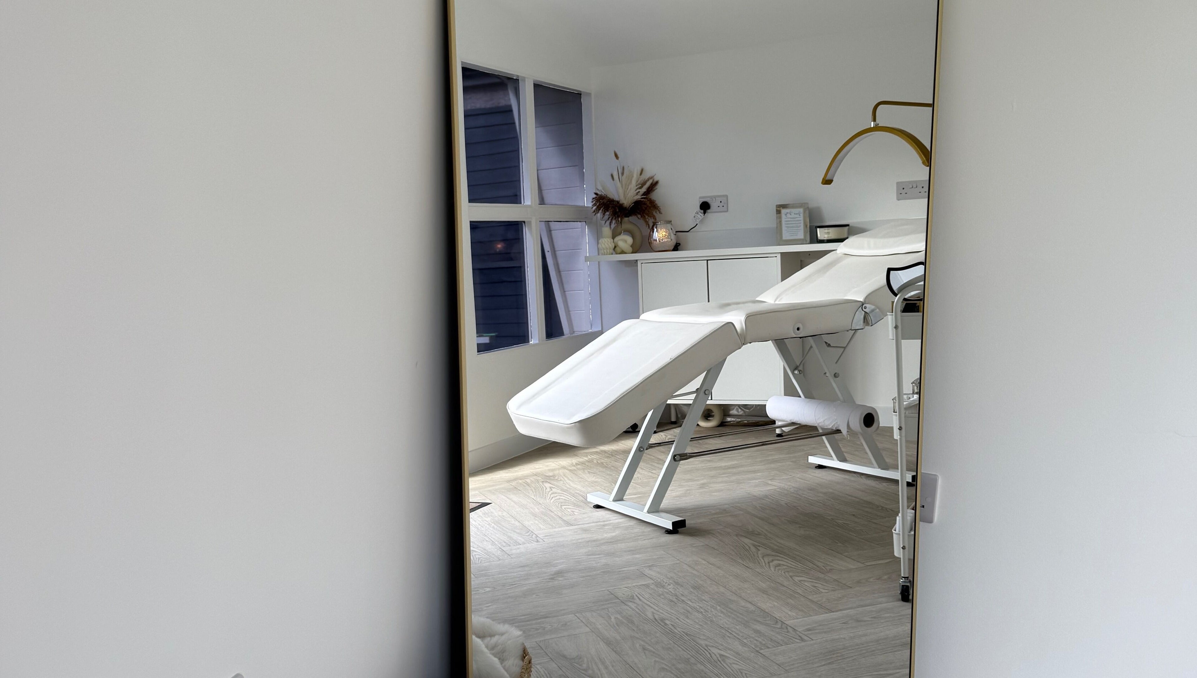 Elegant treatment room at Glam Up by Lex in Coventry, England, GB, showcasing a modern massage bed.