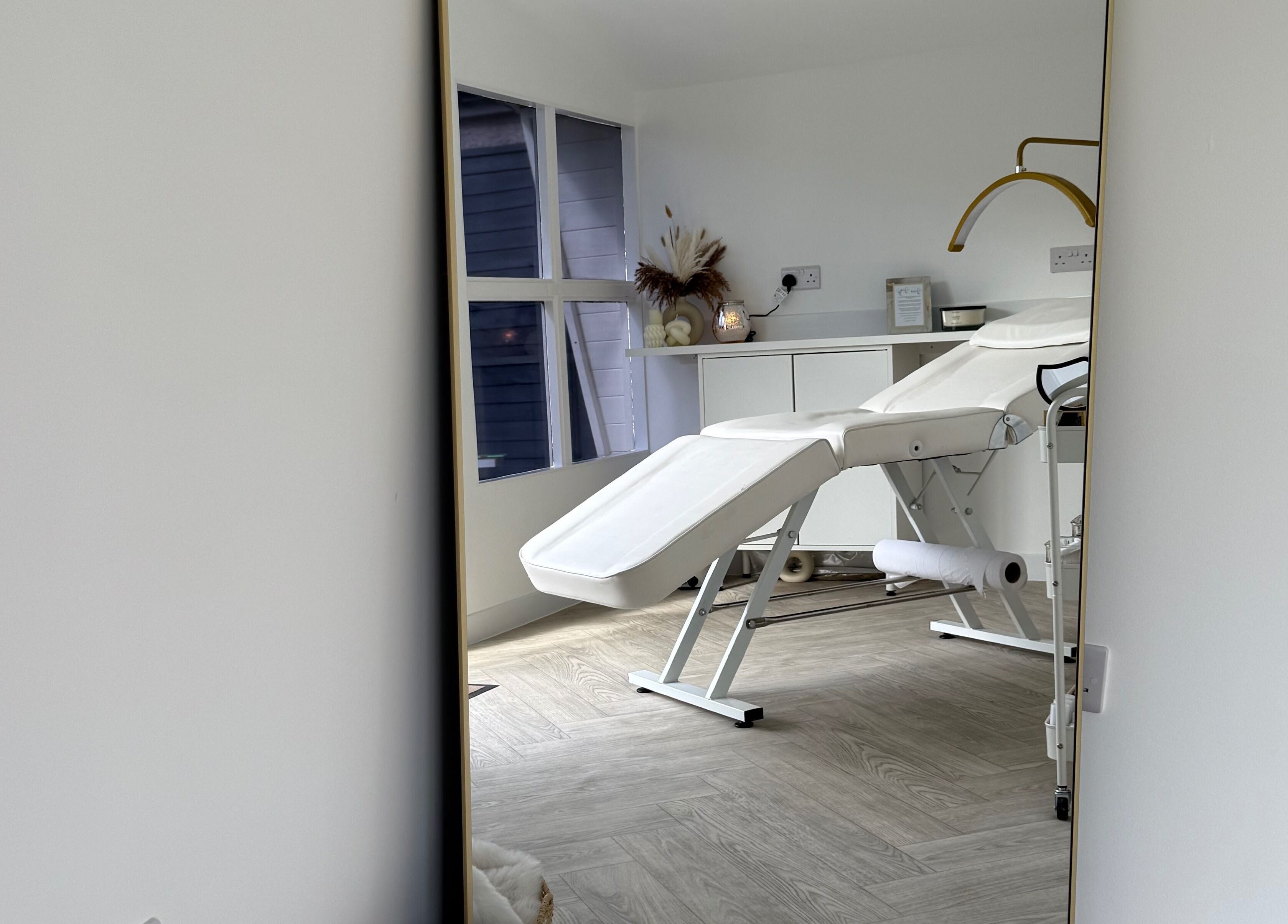 Elegant treatment room at Glam Up by Lex in Coventry, England, GB, showcasing a modern massage bed.