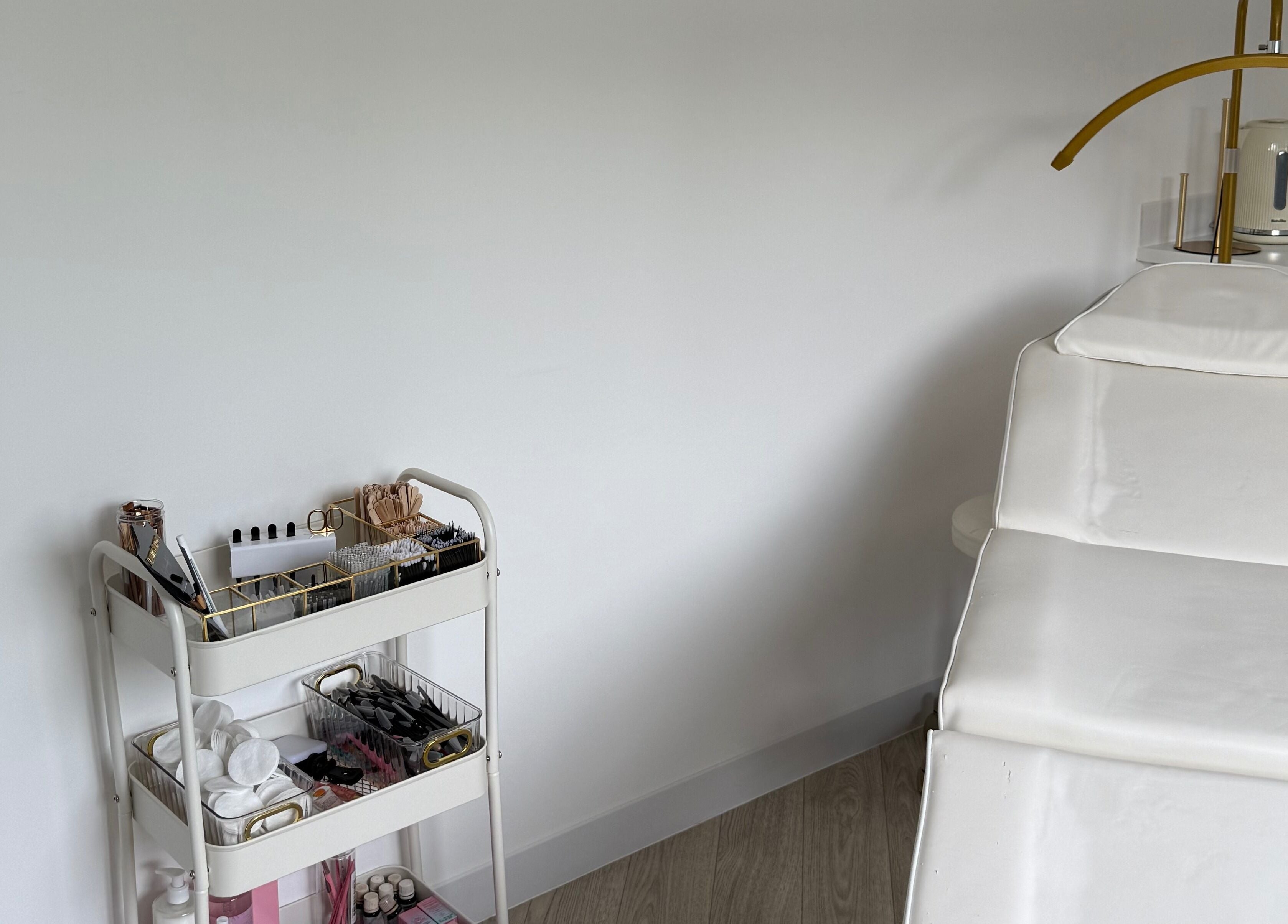 Tranquil treatment room at Glam Up by Lex, Coventry, England, GB, featuring a white chair and organized beauty tools.