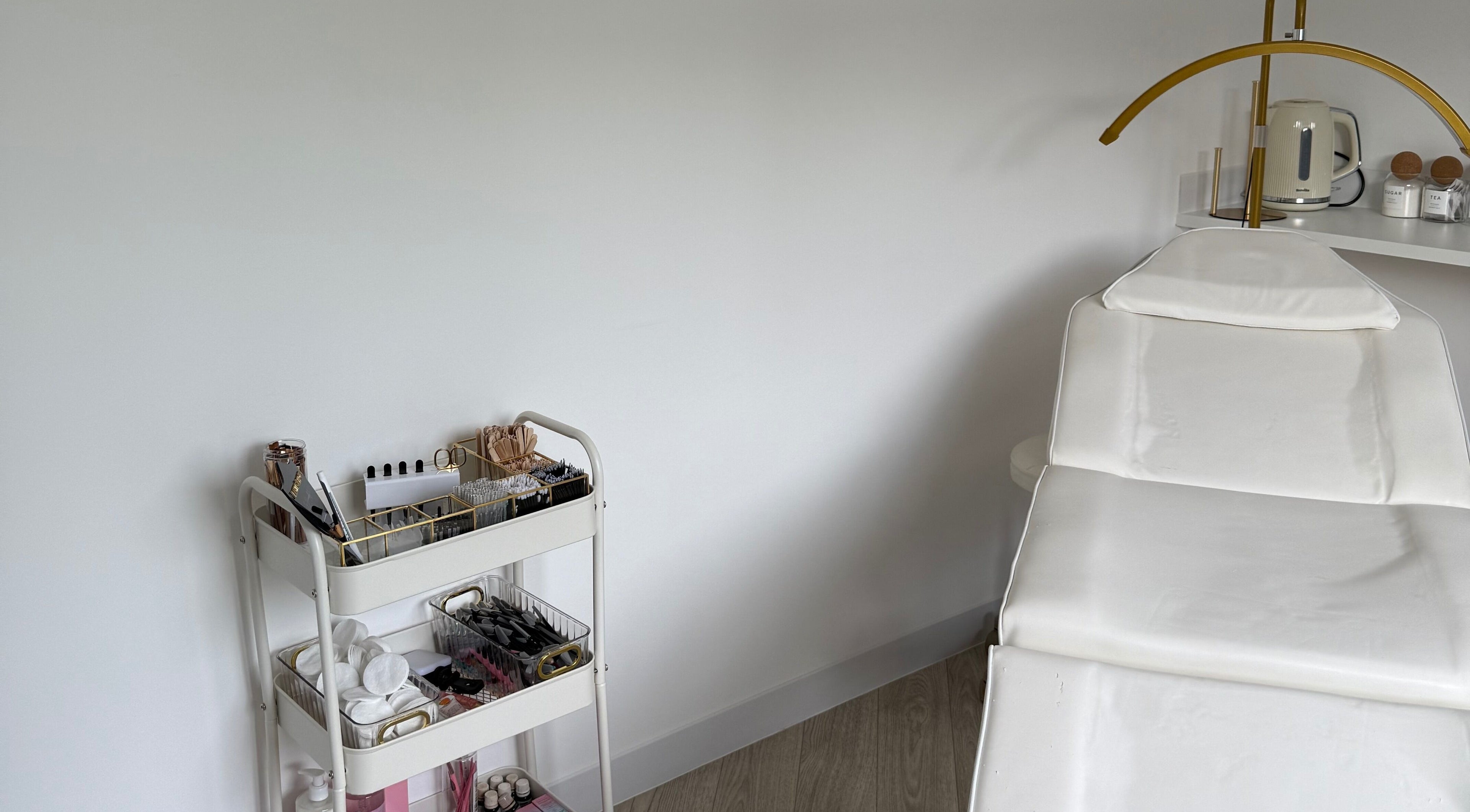 Tranquil treatment room at Glam Up by Lex, Coventry, England, GB, featuring a white chair and organized beauty tools.