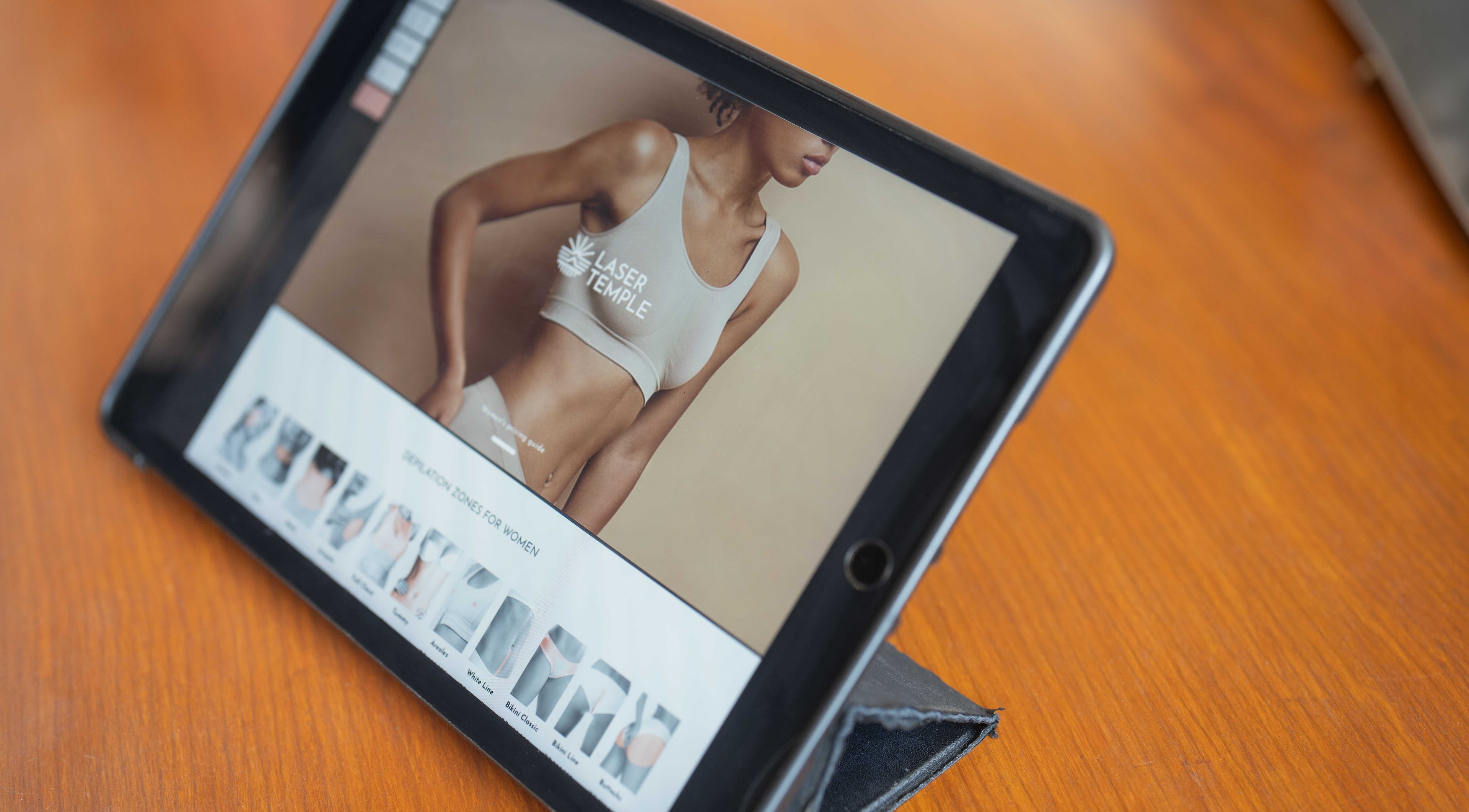 Pantalla de tablet mostrando servicios de Laser Temple en Bali, Bali, ID.