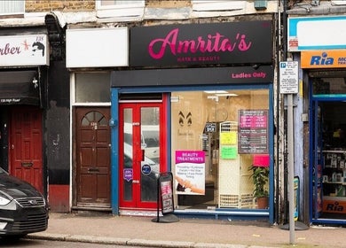 Front view of Amrita's Hair and Beauty salon in London, England, GB, showcasing its vibrant exterior.