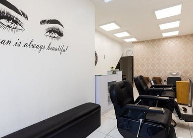 Chic interior of Amrita's hair and beauty, featuring modern styling chairs in London, England, GB.