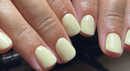 Close-up of lemon-hued nails polished at By Jade Emily, located in Newport, England, GB.