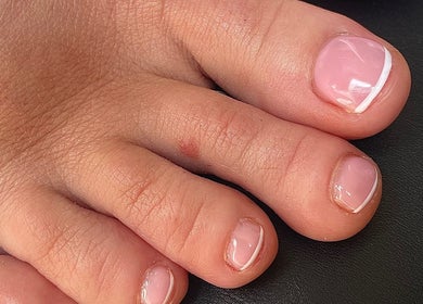 Elegant pedicure with glossy finish at By Jade Emily, Newport, England, GB, highlighting quality nail care.