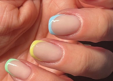 Colorful pastel French manicure at By Jade Emily in Newport, England, GB, showcasing vibrant nail art.