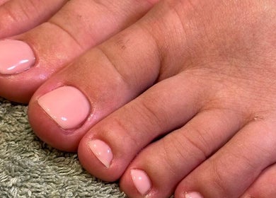 Elegant pedicure featuring pink polished toes at By Jade Emily in Newport, England, GB.