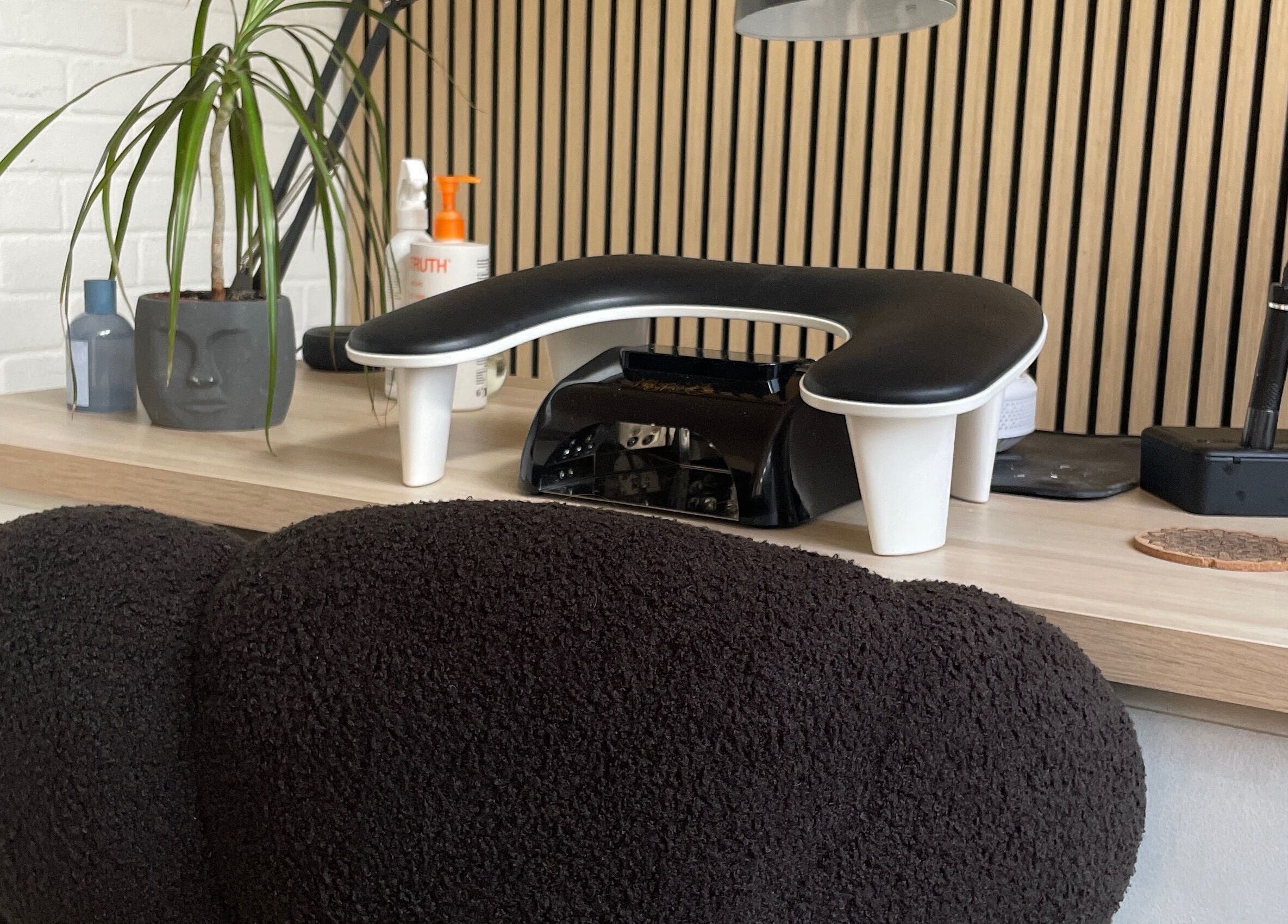 Elegant spa desk with plant and modern tools at By Jade Emily, Newport, England, GB.