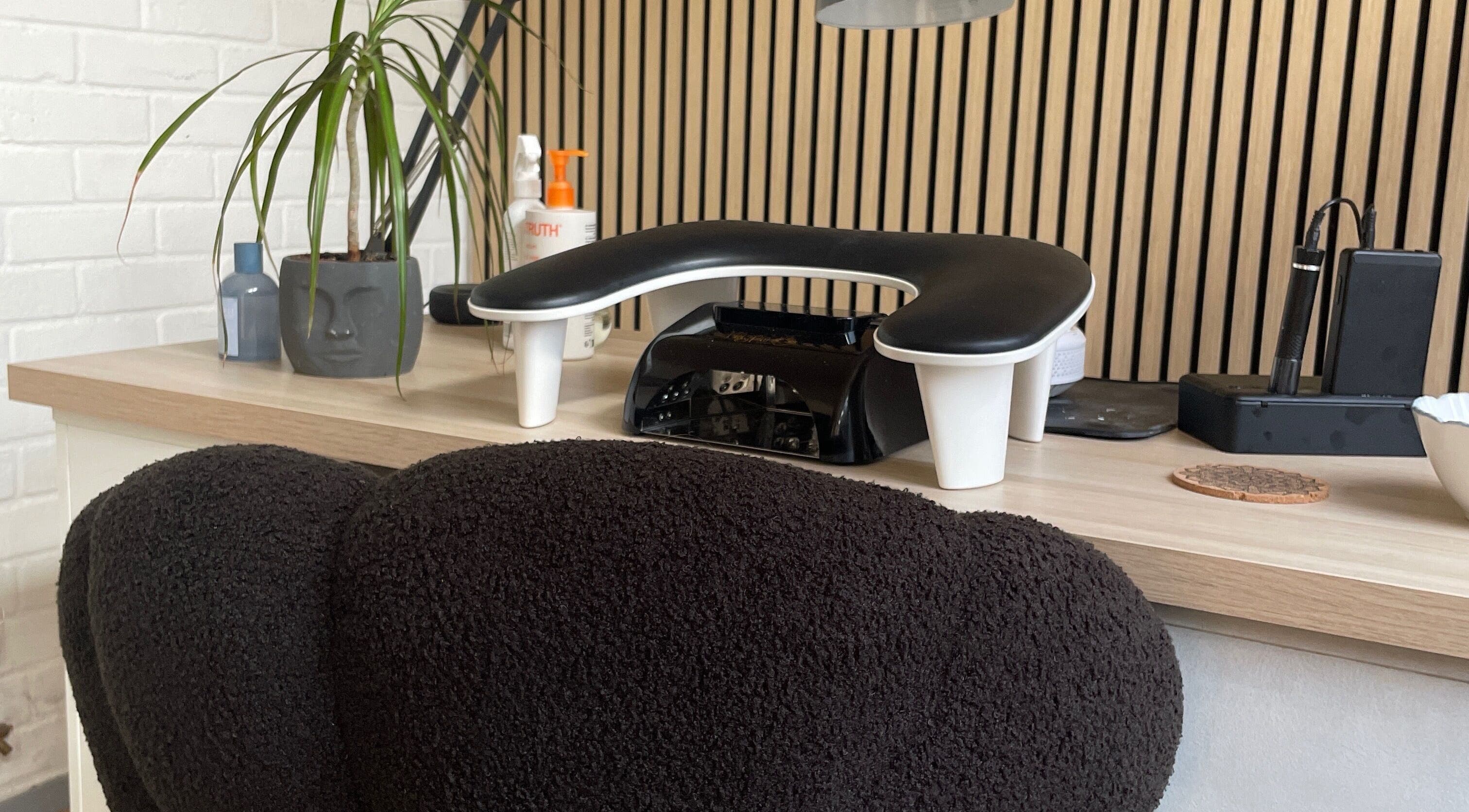 Elegant spa desk with plant and modern tools at By Jade Emily, Newport, England, GB.