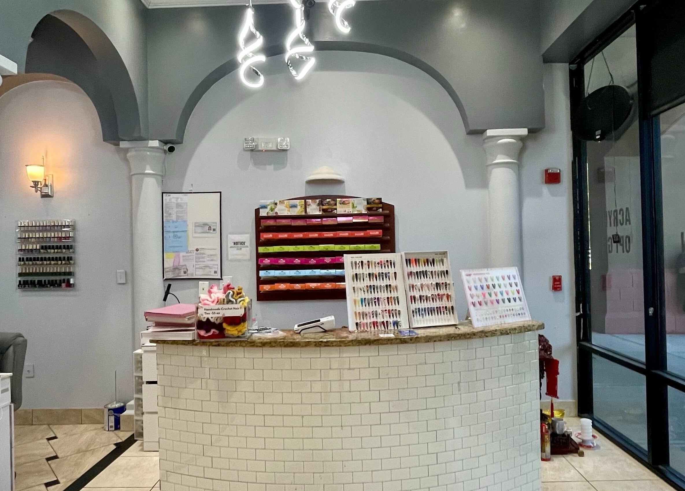 Reception area of Aladdin Nails & Spa in Ocoee, Florida, US, showcasing a stylish and inviting interior.