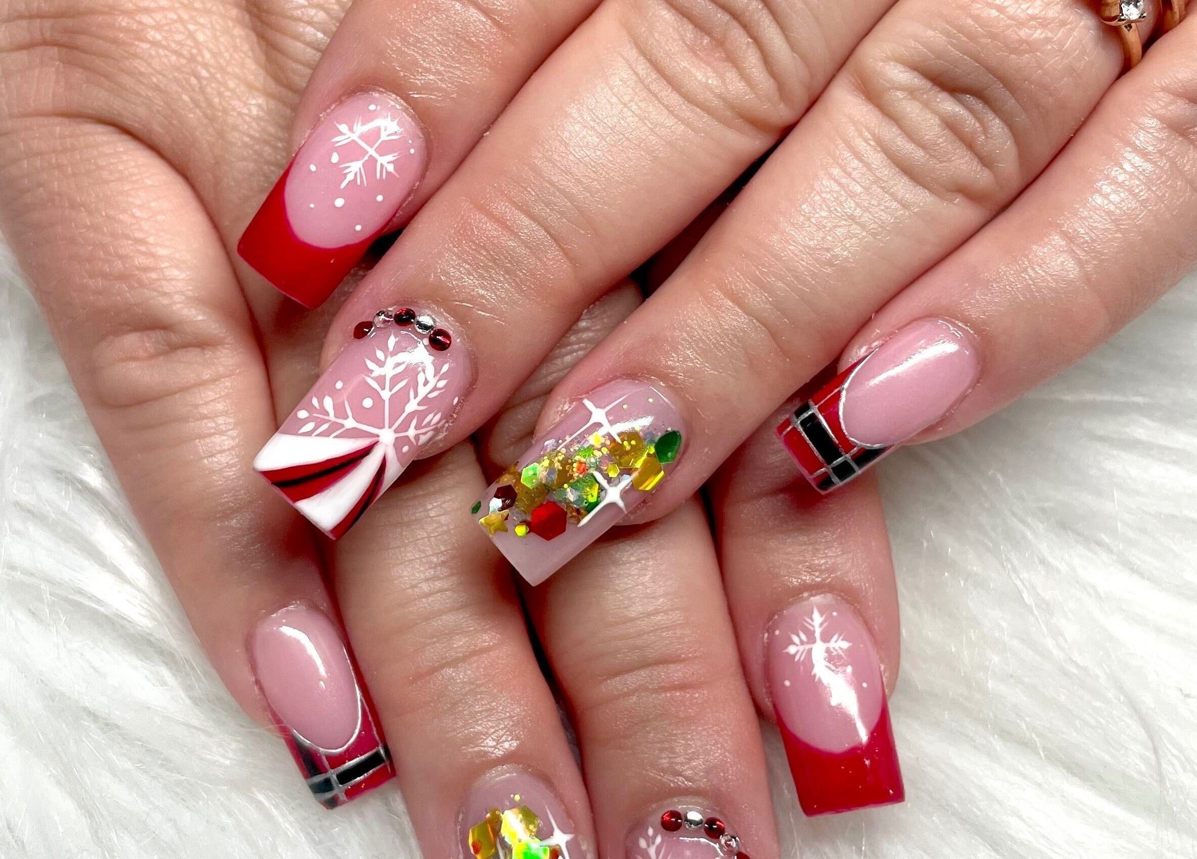 Festive red nail art at Aladdin Nails & Spa in Ocoee, Florida, US.