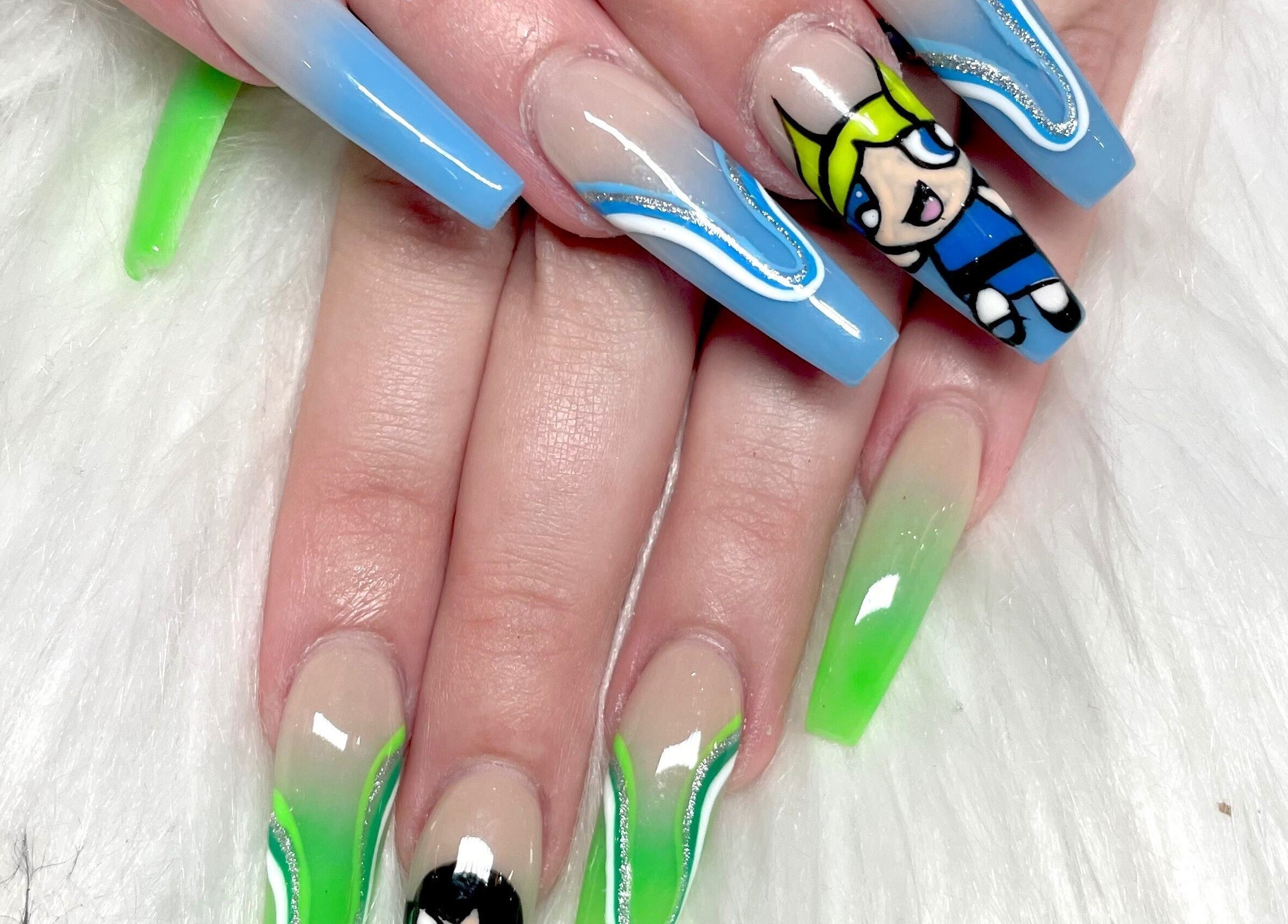 Colorful nail art at Aladdin Nails & Spa, Ocoee, Florida, US featuring vibrant designs and cartoon details.